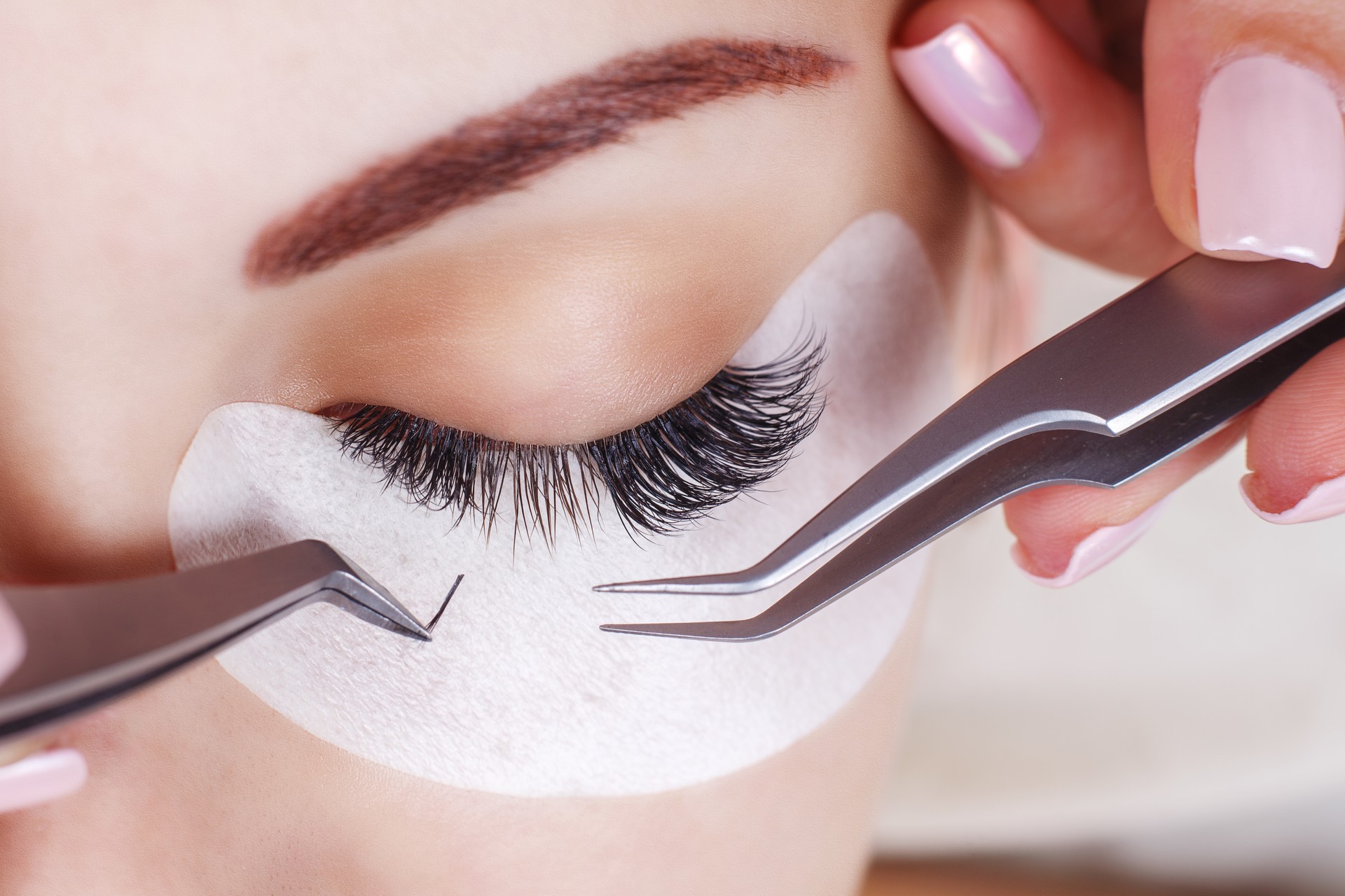 Eyelash Extension Procedure. Woman Eye with Long Eyelashes. Lashes, close up, macro, selective focus